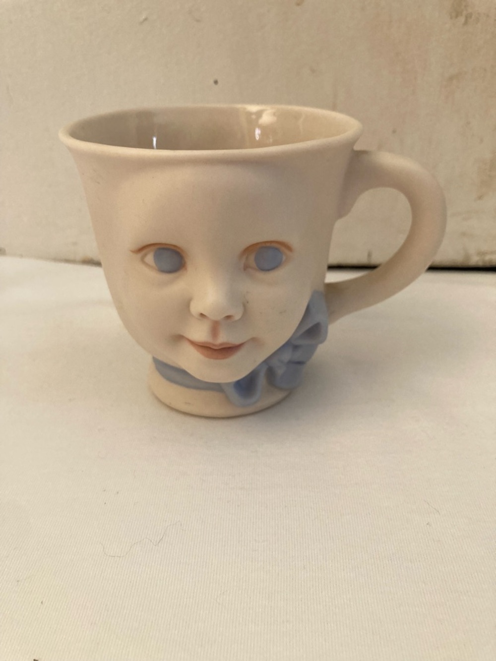 Cream Ceramic Face Mug with Pale Blue Accent - Decorative Drinkware